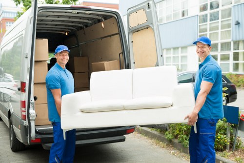 Professional packers handling boxes in Brent