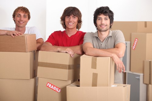 Expert local moving service van navigating city streets in Brent